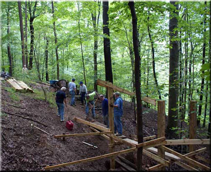 Hiker crossing stormwater bridge